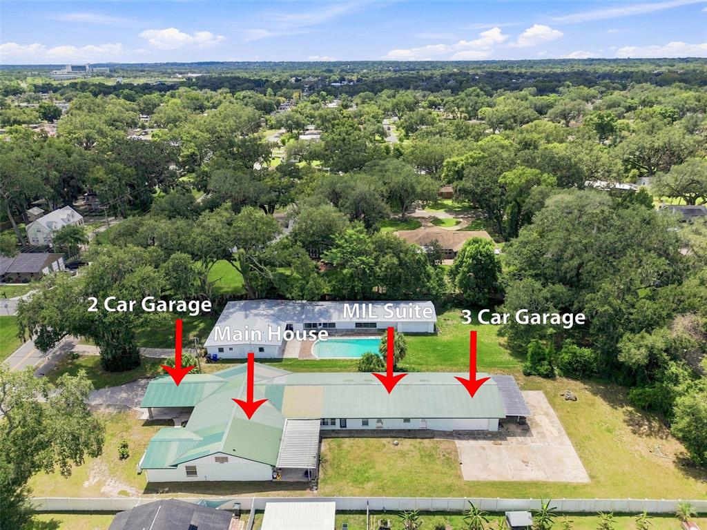 An aerial view shows a house with a pool, a MIL suite, and two garages — 2219 NEW JERSEY RD, LAKELAND, FL