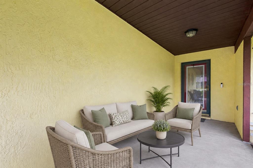 A living room features a ceiling fan, a television, a coffee table, and a cat tree — 5055 CAMBRY LANE, LAKELAND, FL