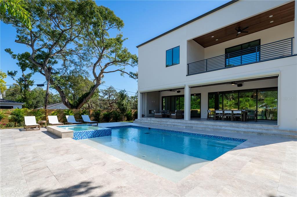 An elevated view of a backyard featuring a swimming pool, hot tub, and palm trees — 2519 N RIVERSIDE DR, TAMPA, FL