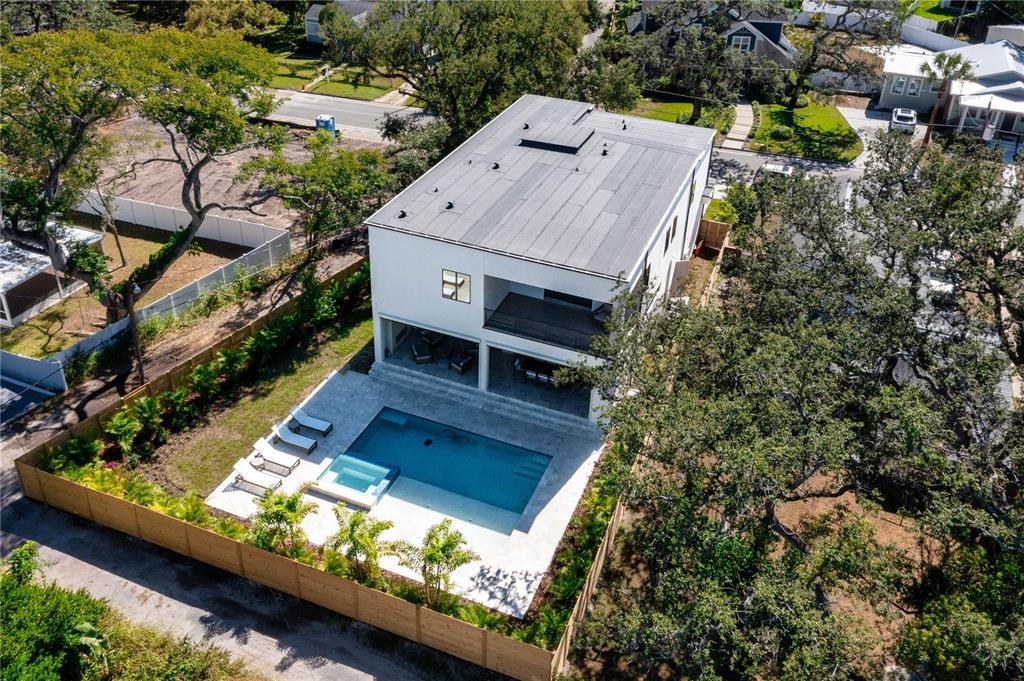 This 3D floor plan rendering shows a house with a three-car garage and backyard pool — 2519 N RIVERSIDE DR, TAMPA, FL