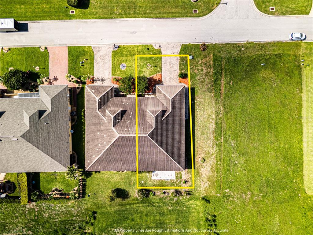 An aerial view shows a residential house with a yellow outline indicating the property boundaries — 6938 CECILIA AVENUE, SEBRING, FL