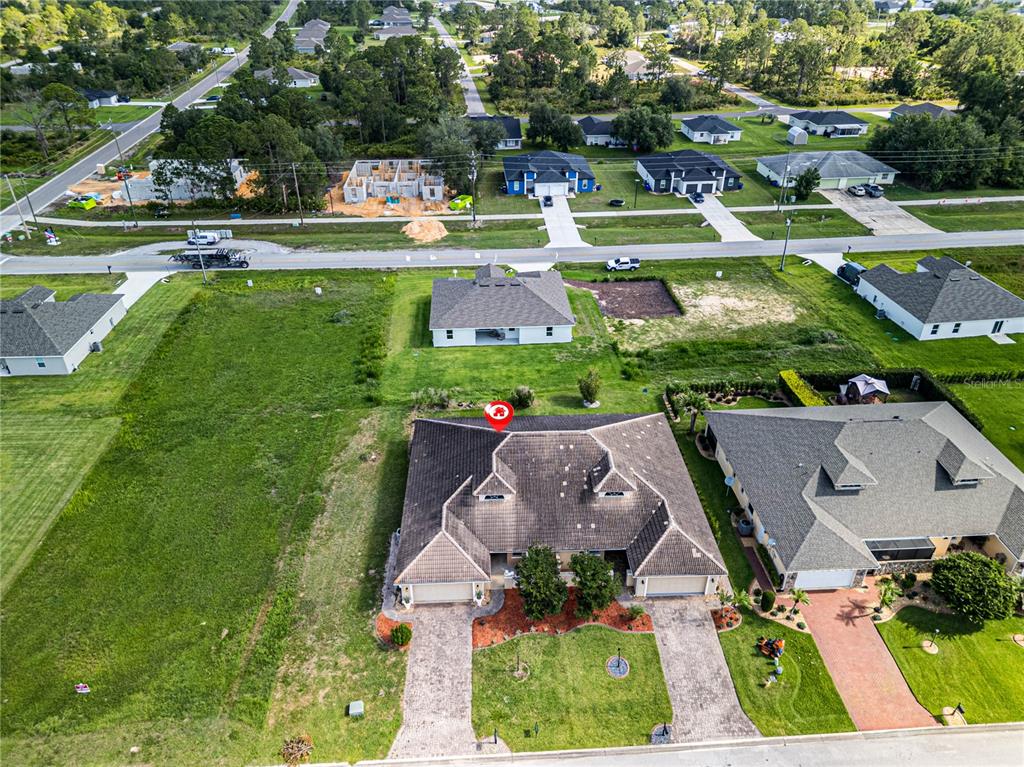 An aerial view shows a residential neighborhood with several houses, including one marked with a red pin — 6938 CECILIA AVENUE, SEBRING, FL