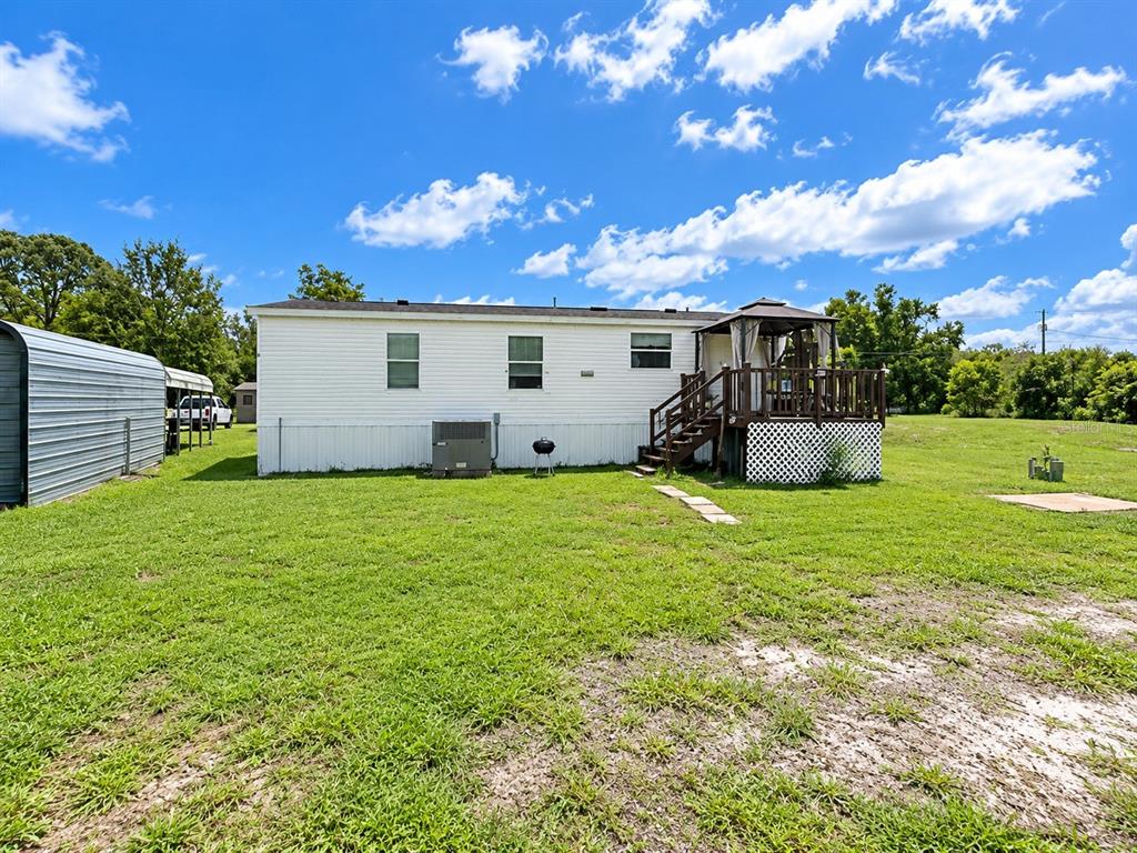 9027 HAMMOCK LOOP, POLK CITY, FL — photo 3 of 7