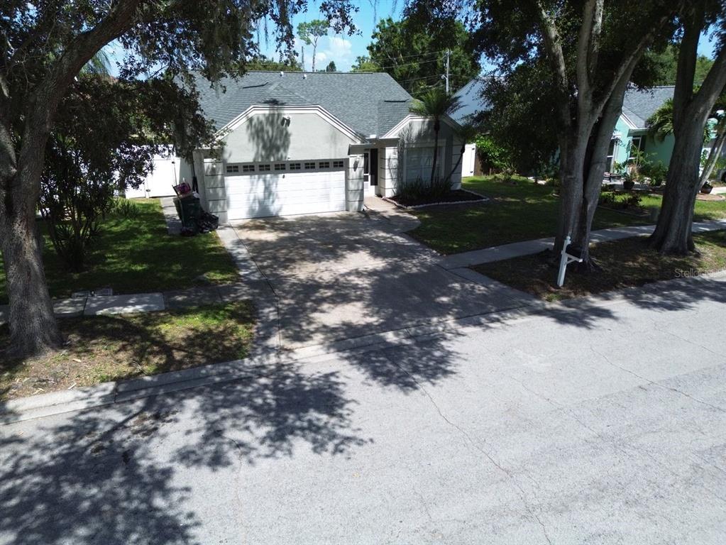 An aerial view of a single-story house with a two-car garage and a paved driveway — 3363 MARION DRIVE, PALM HARBOR, FL