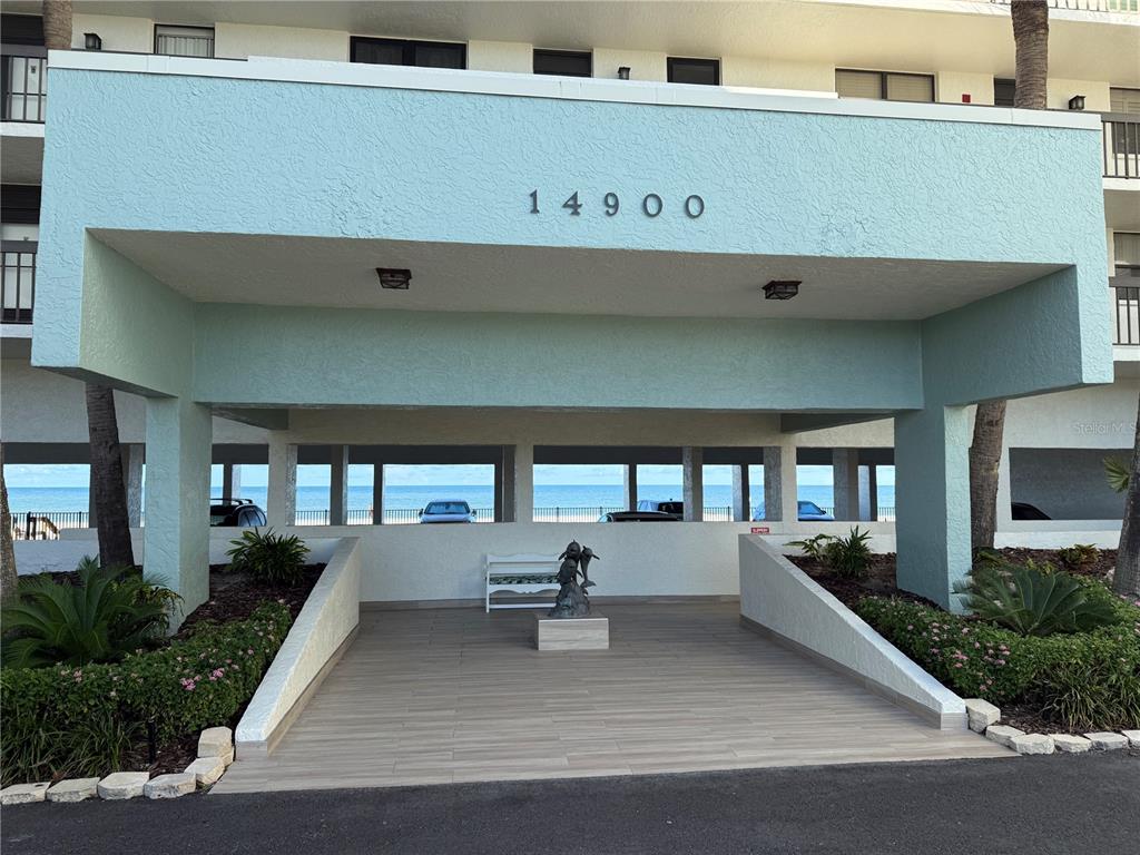 A view of a sandy beach and the ocean under a clear blue sky — 14900 GULF BOULEVARD UNIT 113, MADEIRA BEACH, FL