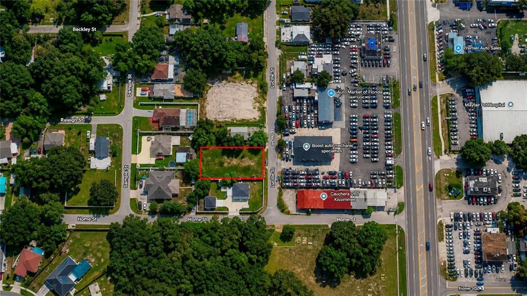 This is an aerial map showing a vacant rectangular lot outlined in red — 2743 LUCILLE STREET, KISSIMMEE, FL
