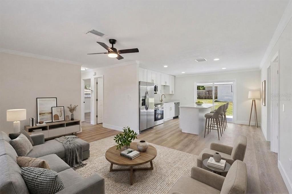 A single-story house with white stucco walls, gray trim, and a wooden fence — 2715 TIMBERLAKE AVENUE, DELTONA, FL