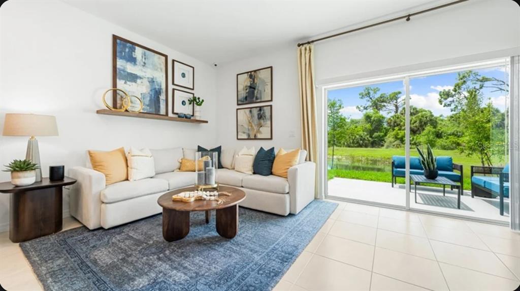 This is a floor plan showing the upper level of a home with three bedrooms — 7187 GRAND FOREST WAY, NOKOMIS, FL