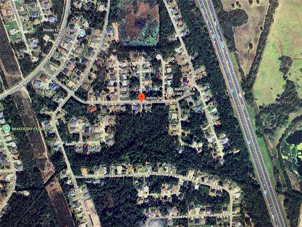 This is an aerial map view of a residential neighborhood with a red location marker — 000 SEFERIS PATH PATH, PALM COAST, FL