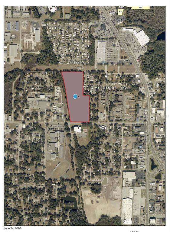 An aerial map shows a highlighted parcel of land surrounded by residential and commercial development — GRIFFIN ROAD, LEESBURG, FL