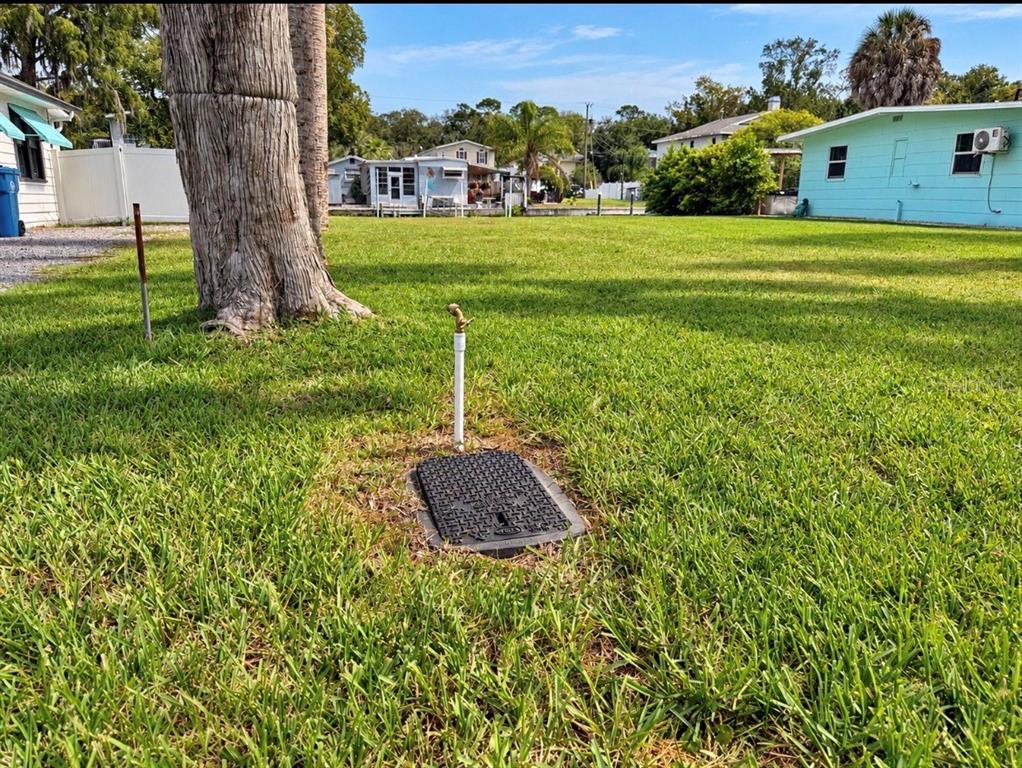 An aerial view shows a house with a canal, surrounding trees, and a location marker — 7250 COVENTRY COURT, WEEKI WACHEE, FL