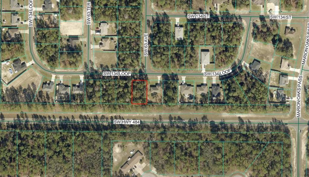 This is an aerial map view showing a vacant residential lot outlined in red — TBD SW 134 LOOP, OCALA, FL