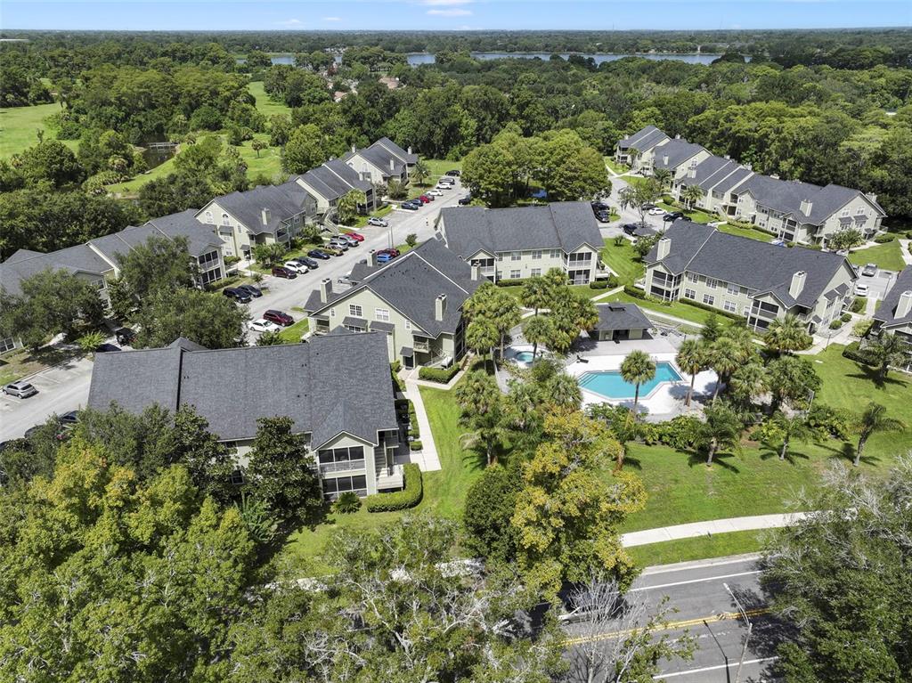 An aerial view shows a multi-building apartment complex with a swimming pool and parking lots — 3721 S LAKE ORLANDO PARKWAY UNIT 8, ORLANDO, FL