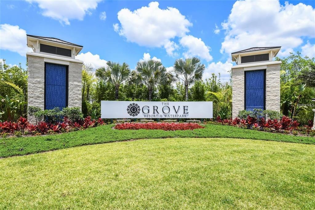 A sign for The Grove Resort & Waterpark stands between two stone pillars with blue panels — 14501 GROVE RESORT AVENUE UNIT 2221, WINTER GARDEN, FL