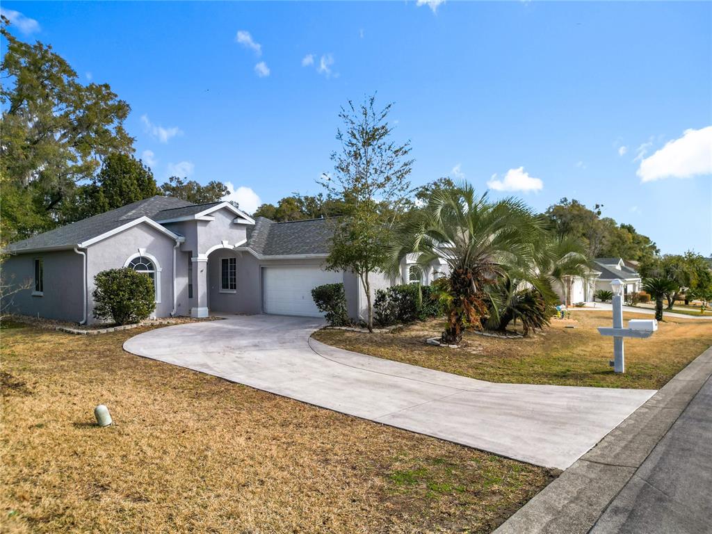 The exterior wall of a building features a sign reading Ocala Palms with palm trees — 5375 NW 26TH LANE, OCALA, FL