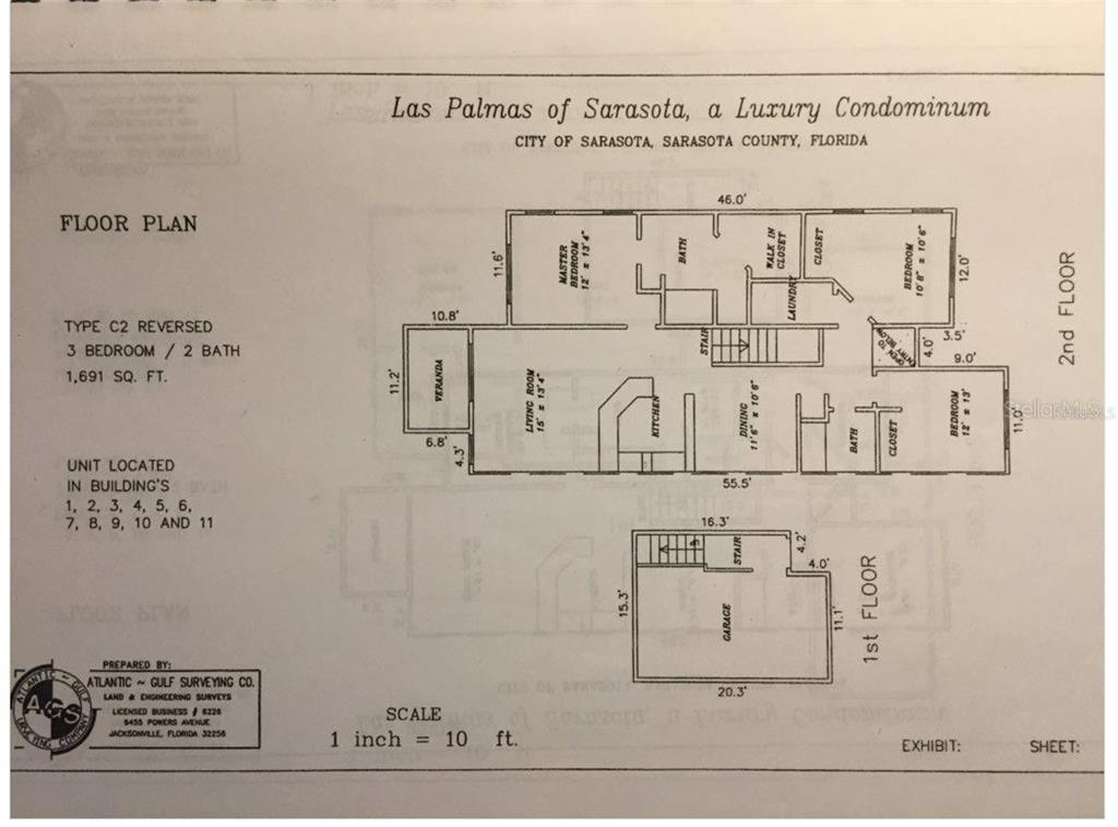 A carpeted staircase leads down to a landing with a white door and wood flooring — 5655 BENTGRASS DRIVE UNIT 9-117, SARASOTA, FL