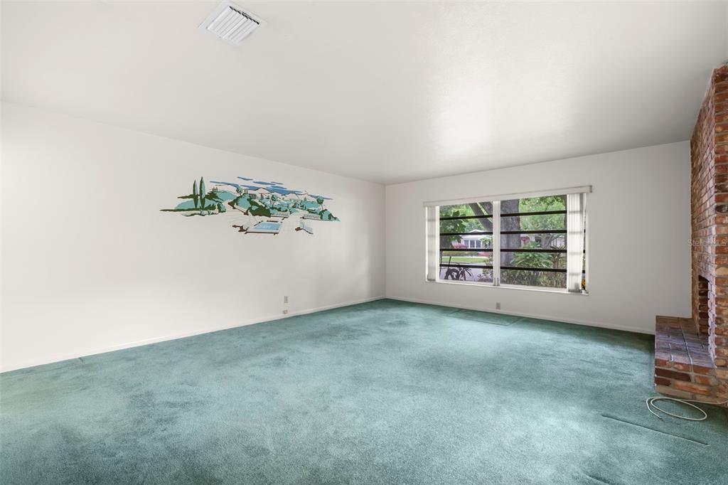 A covered entryway features double doors, brick walls, and a brick-paved floor — 2616 S TORONTO AVENUE, TAMPA, FL