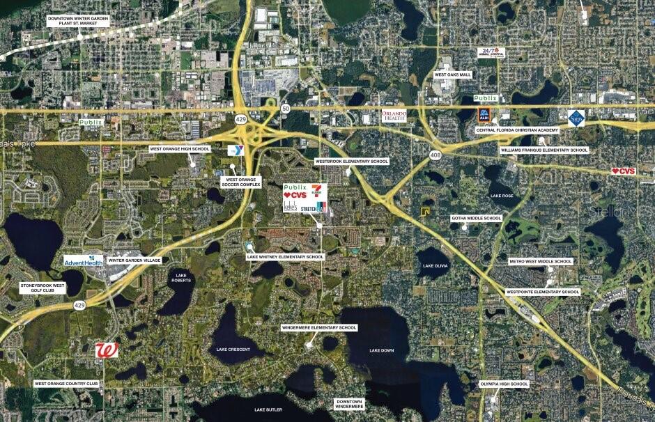 This is an aerial map showing residential neighborhoods, schools, lakes, and commercial areas in Florida — 9717 MORTON JONES ROAD, GOTHA, FL