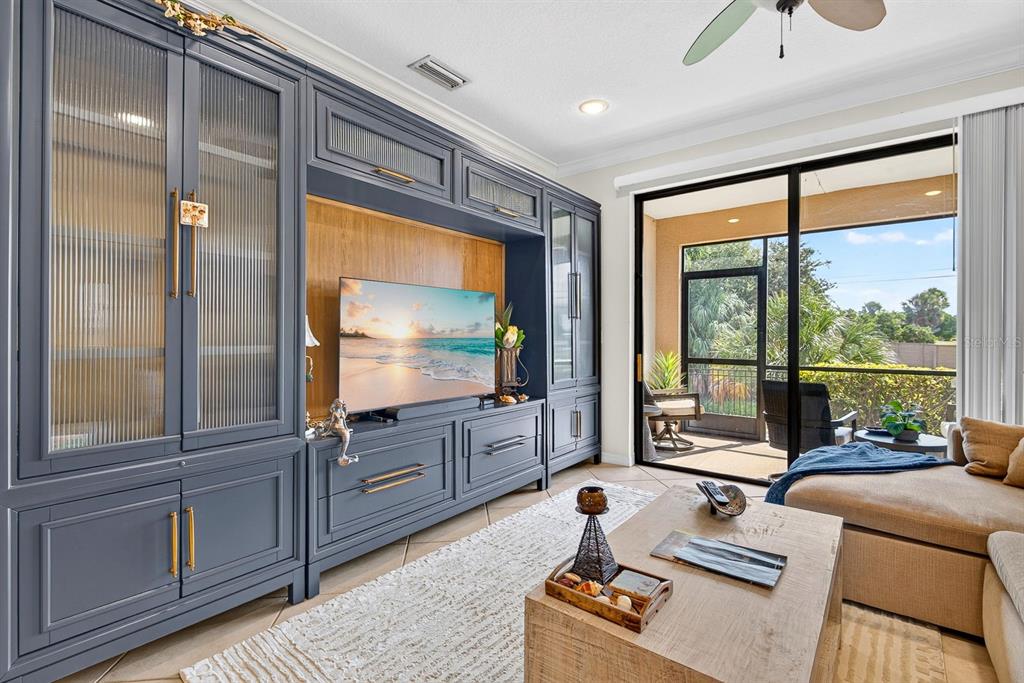 An entryway with tile flooring, a white front door, and a wall-mounted clock — 7228 HAMILTON ROAD UNIT 7228, BRADENTON, FL