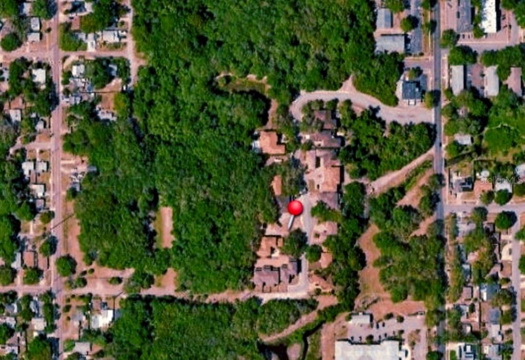 This aerial map view shows a residential property marked with a red pin — 1968 FREEDOM DRIVE, CLEARWATER, FL