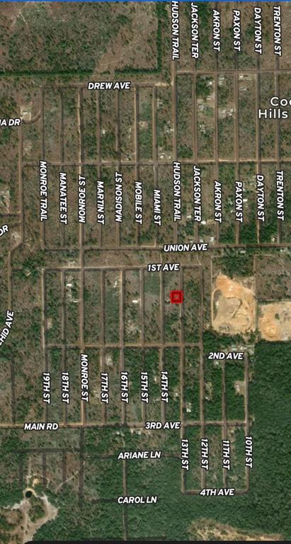 This is a satellite map showing a grid of streets and a highlighted property lot — LOT 47 & 48 13TH STREET, INTERLACHEN, FL