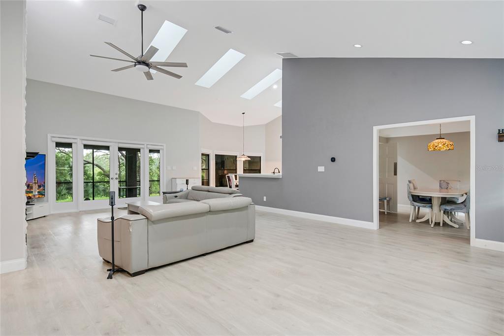 An aerial view of a brick house with a gray shingled roof and concrete driveway — 1937 HIDDEN PINE LANE, APOPKA, FL