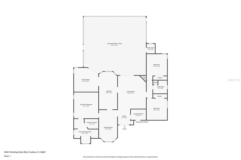 A single-story brick and siding house with a front-facing garage and a landscaped yard — 18451 WINDING OAKS BOULEVARD, HUDSON, FL