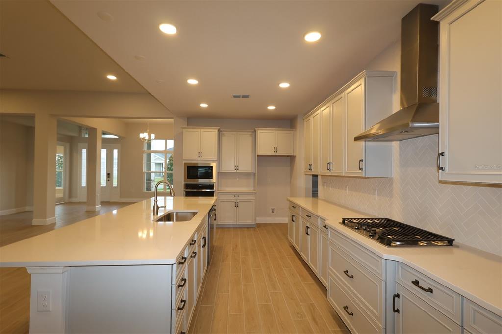 An unfinished room with drywall, a large window, and a low partition wall — 3193 WOLF LAKE AVENUE, APOPKA, FL