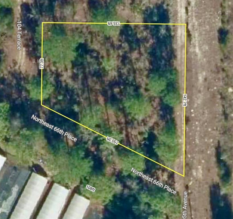This is an aerial map showing the property boundaries and dimensions of a vacant lot — 000 66TH PL. NE, BRONSON, FL