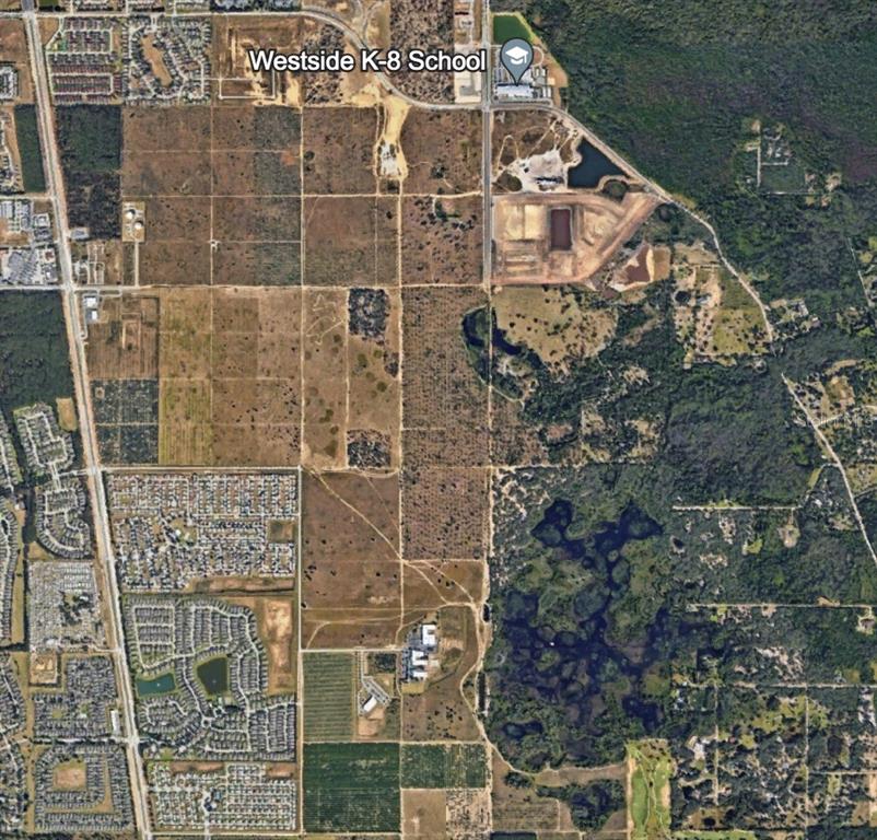 This aerial map shows a school, residential developments, and surrounding undeveloped land — WESTSIDE BOULEVARD, KISSIMMEE, FL