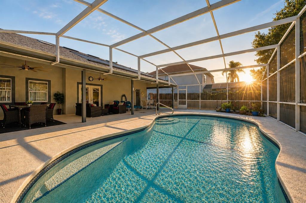 A single-story house with gray stucco, brick accents, and a front walkway under a clear sky — 2948 PEMBRIDGE STREET, KISSIMMEE, FL