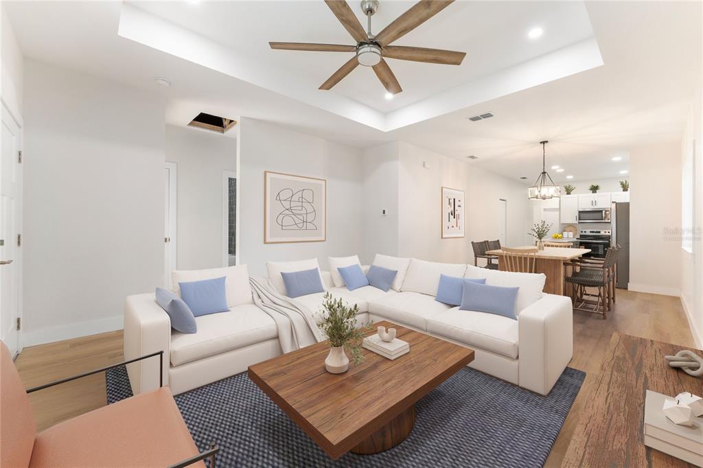 A newly constructed single-story house with light siding and a covered front porch — 925 NE 17TH DRIVE, GAINESVILLE, FL