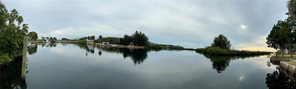 A panoramic view of a calm waterway surrounded by mangroves and residential properties — 3044 SUNSET VISTA DRIVE, SPRING HILL, FL