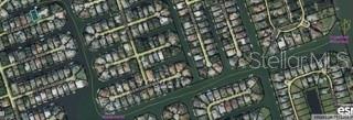 This is an aerial map view of a residential neighborhood with houses along canal waterways — 15 CEDARDALE COURT, PALM COAST, FL
