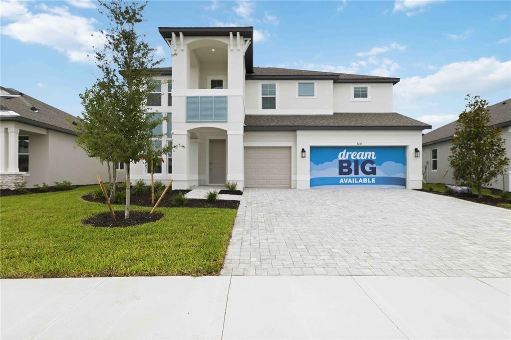 A two-story suburban house with a white exterior, a paved driveway, and a garage — 3685 142ND TERRACE E, PARRISH, FL