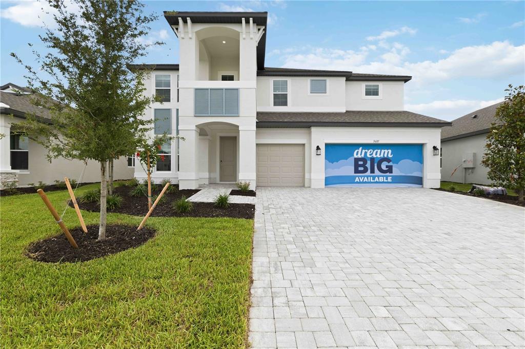 A modern two-story house with a paved driveway, a garage, and a covered entryway — 3685 142ND TERRACE E, PARRISH, FL