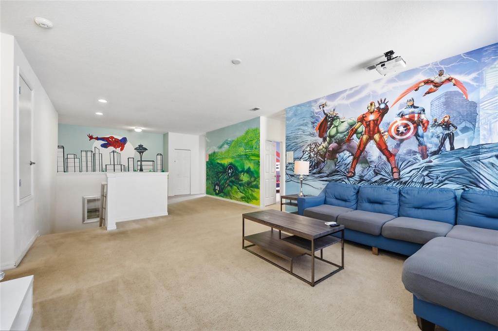 A bedroom with Star Wars-themed wall murals, two twin beds, and a black dresser — 6116 BROAD OAK DRIVE, DAVENPORT, FL