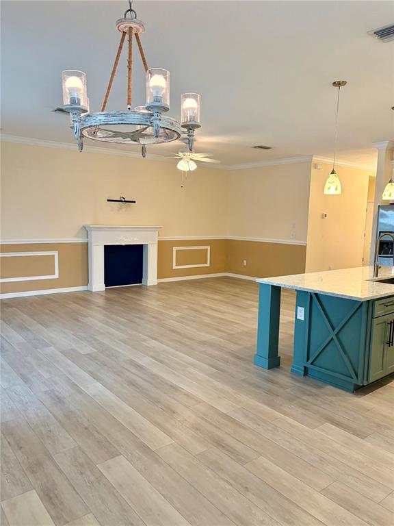 A bright entryway features a white front door, coastal decor, and a blue runner rug — 13605 PADDINGTON WAY, SPRING HILL, FL