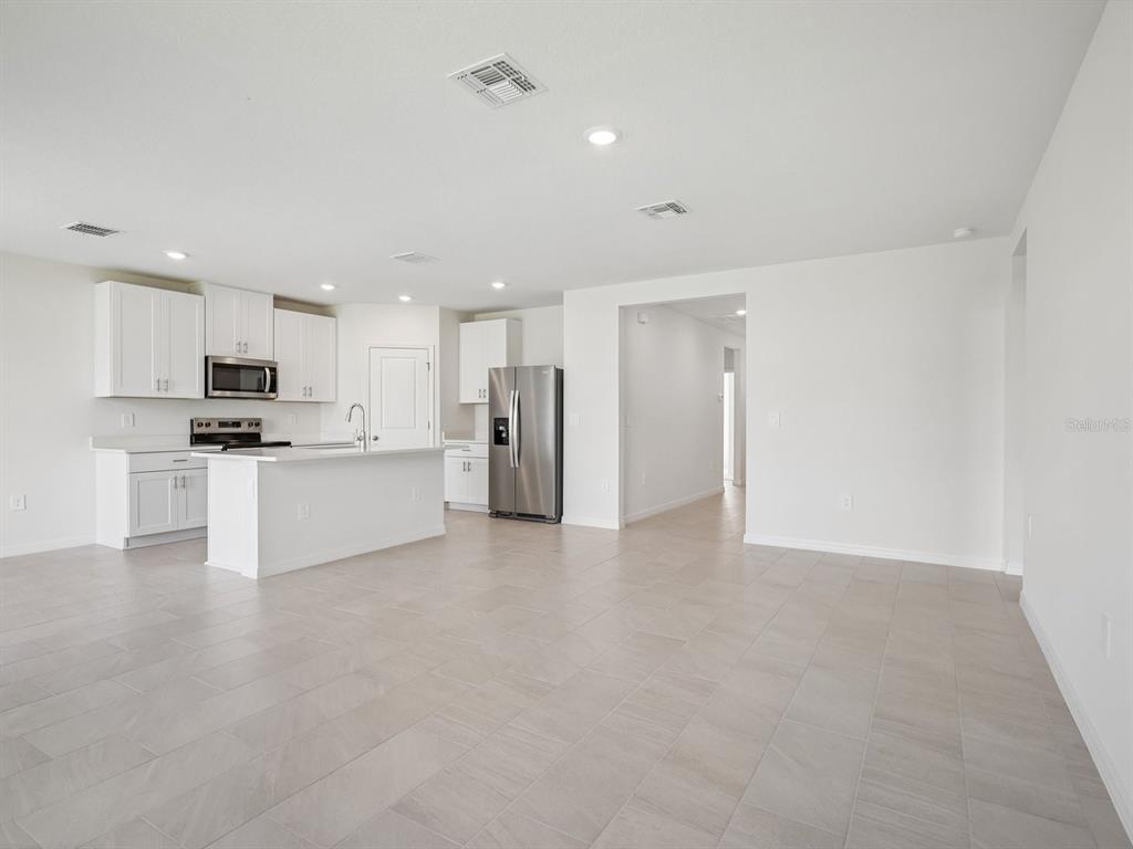 This is a floor plan for a single-story home with three bedrooms and a garage — 1369 OAK VALLEY DRIVE, AUBURNDALE, FL