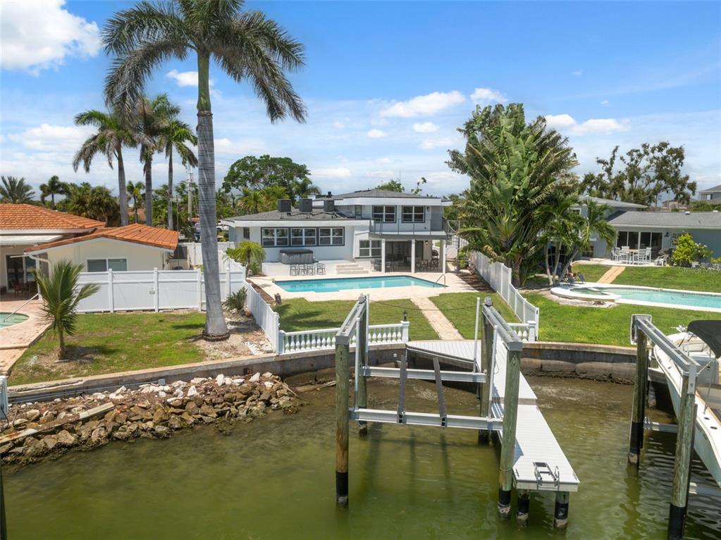 An aerial view shows waterfront homes with private docks along a bay in Florida — 900 79TH STREET S, ST PETERSBURG, FL