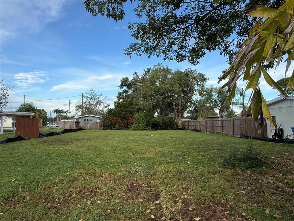 This is a rendering of a two-story house with a white exterior and two garages — 9000 1ST STREET N, ST PETERSBURG, FL
