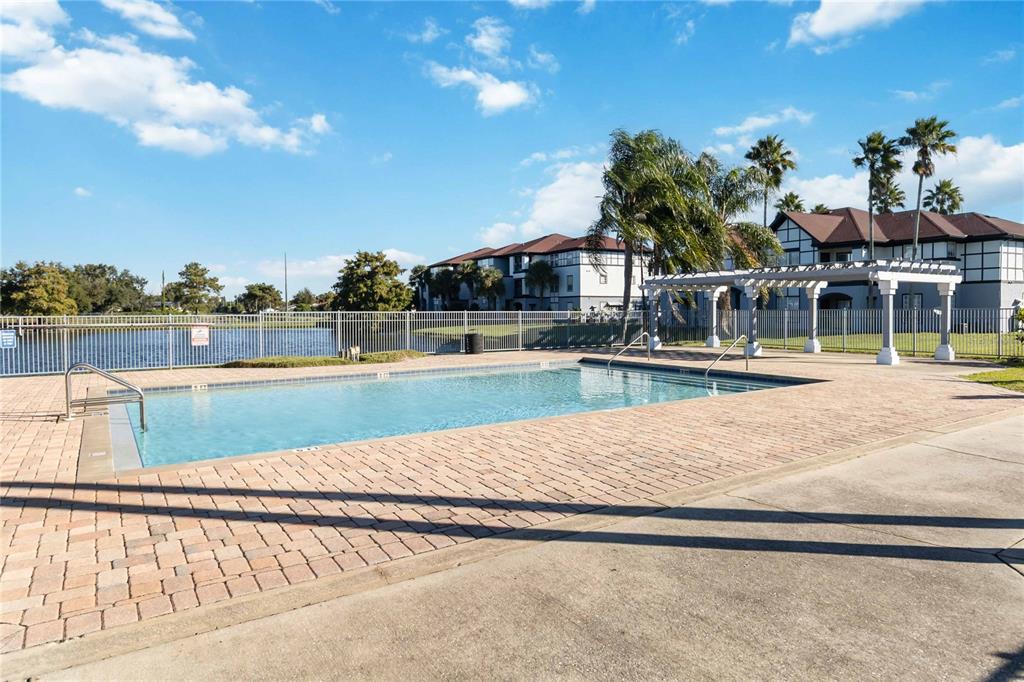 A black front door with the number 5336 is located on a concrete apartment building walkway — 3714 PALM DESERT LANE UNIT 5336, ORLANDO, FL