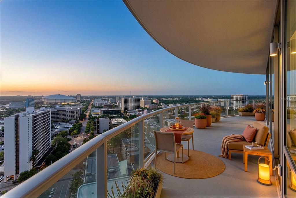 A lounge area features a large abstract mural, a gray sofa, and two dark armchairs — 400 CENTRAL AVENUE UNIT 2001, ST PETERSBURG, FL
