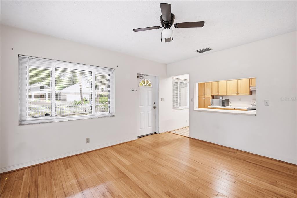 A kitchen features oak cabinets, stainless steel appliances, a breakfast bar, and tile flooring — 2814 W PRICE AVENUE, TAMPA, FL