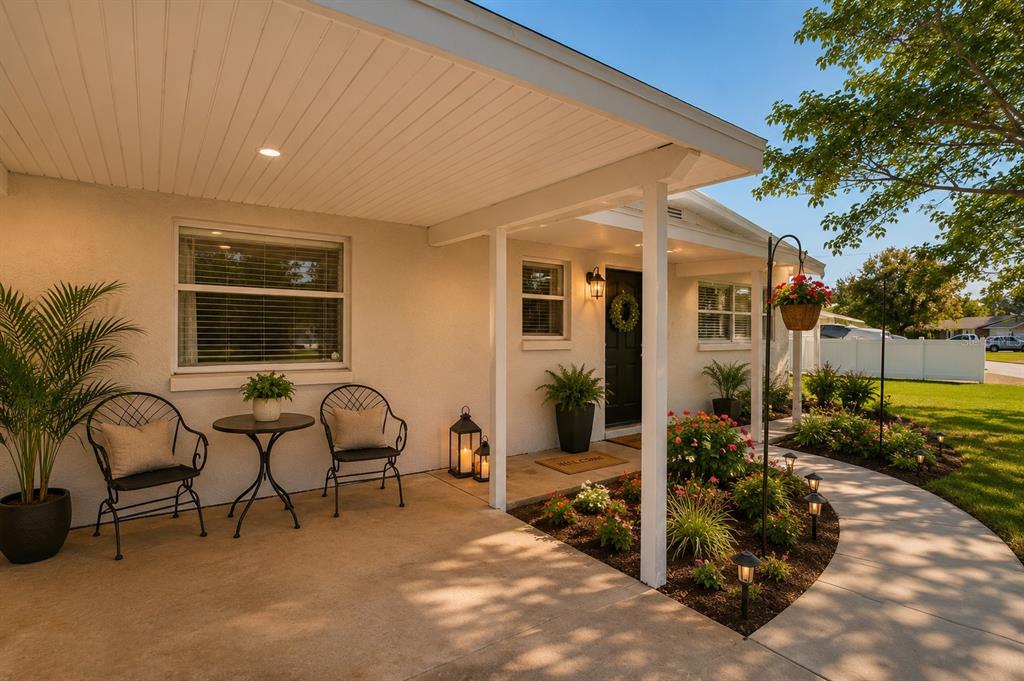 A single-story house with a carport and large trees in the front yard — 541 FIREFLY LANE, APOLLO BEACH, FL