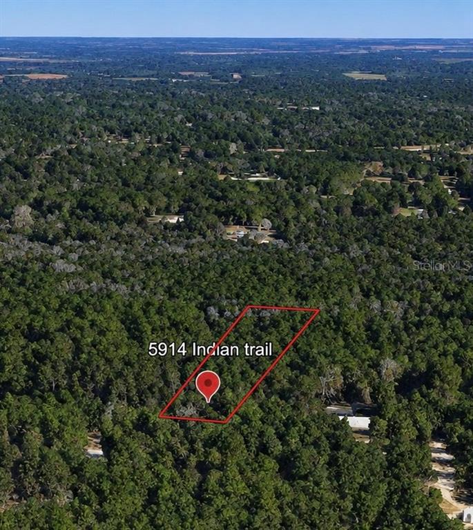This is an aerial map view of a wooded lot outlined in red — 5914 INDIAN TRAIL, KEYSTONE HEIGHTS, FL