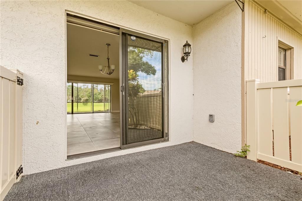 An entryway features tiled floors, a mirrored wall, a wooden shoe bench, and louvered closet doors — 260 MICHAELS CIRCLE, OLDSMAR, FL