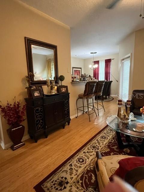 A dining area with a breakfast bar and a dark wood cabinet with a mirror — 1910 E PALM AVENUE UNIT 10303, TAMPA, FL