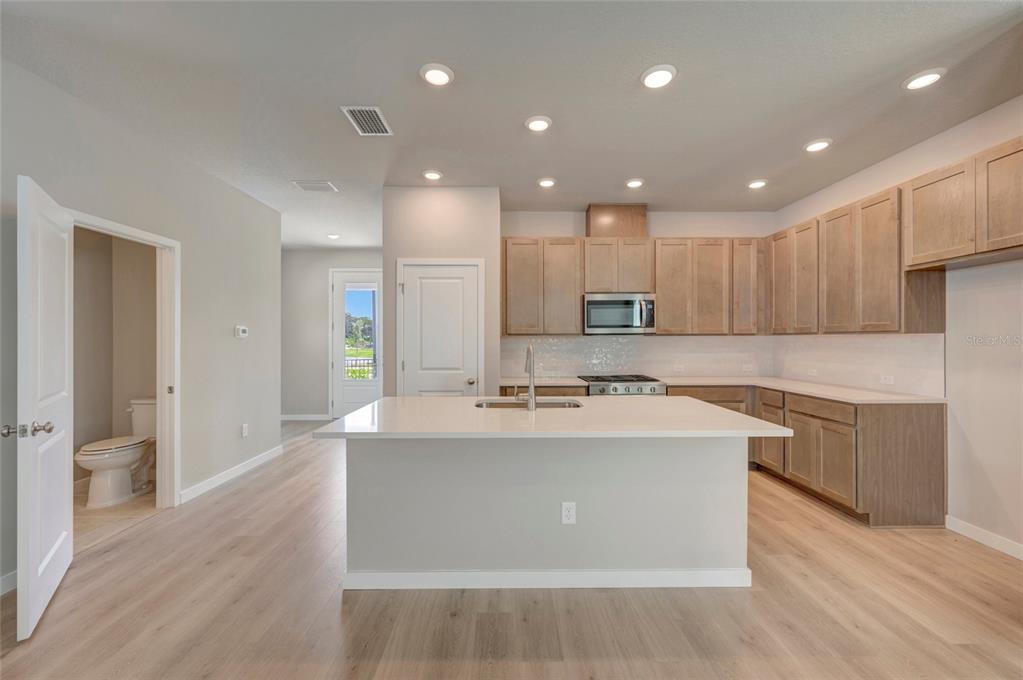 This is a floor plan for the first level of a home featuring a garage — 2823 CRIMSON CAP STREET, ODESSA, FL