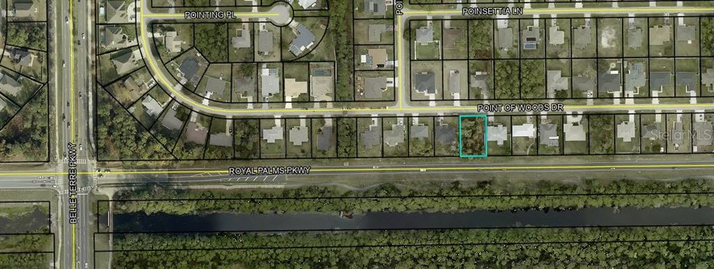 This is an aerial map showing a vacant residential lot highlighted in blue along a street — 54 POINT OF WOODS DRIVE, PALM COAST, FL